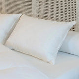 Oreiller mi-ferme en duvet pour soutien cervical et sommeil confortable